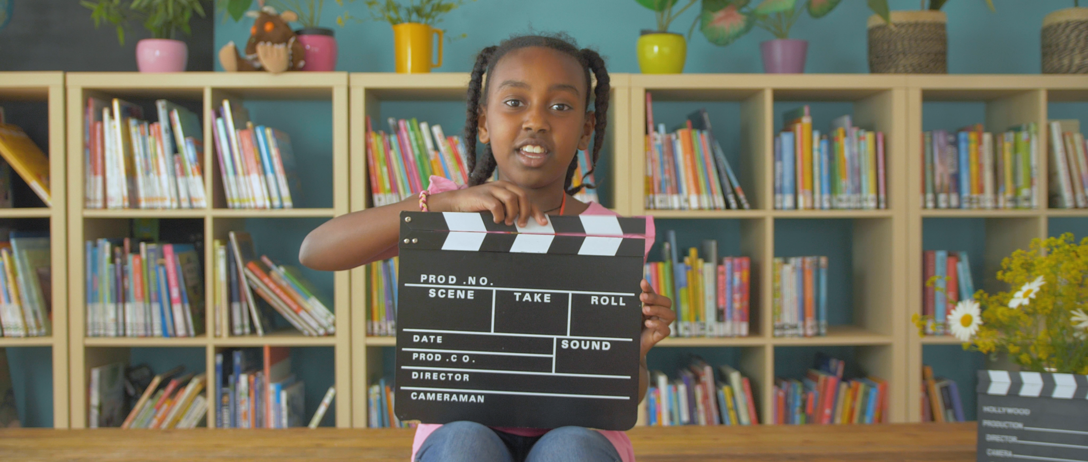 Melat met filmklapper